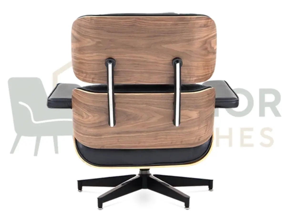A luxury accent chair featuring a rich walnut shell, ergonomic black leather seating and a powder-coated black frame, available online from Interior Furnishes starting at £799.