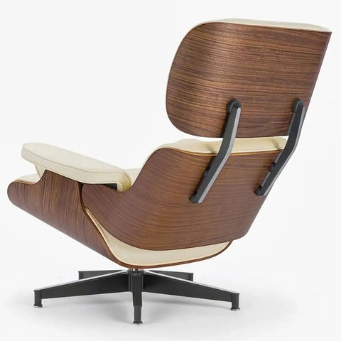 A mid-century modern lounge chair with a curved wooden shell, cream-colored leather cushions, and a black five-star swivel base, shown from a three-quarters angle on a light gray background.