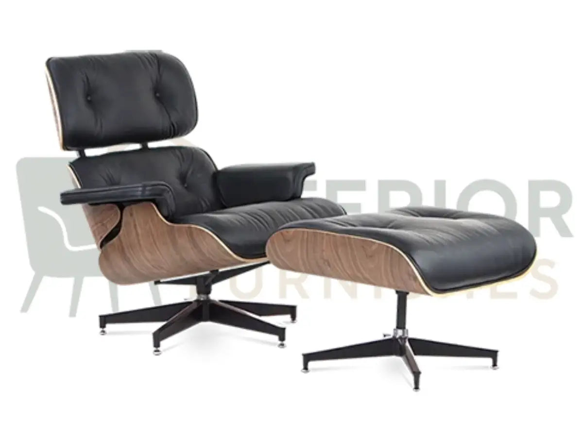 A black leather lounge chair with a matching ottoman, both featuring light wood sculpted shells and black metal swivel bases, shown against a white background with a faint interior furnishings watermark.