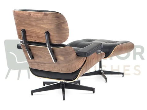 Designed for contemporary interiors, this mid-century walnut lounge chair replica combines genuine walnut veneer, black leather cushions and a sleek black base with delivery throughout the UK, EU and USA.