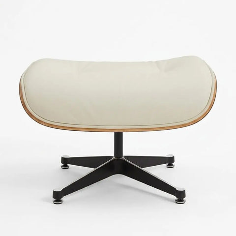 An outdoor lounge chair with a curved cream-colored cushioned seat, a light wood frame, and a black five-star metal base, shown against a plain white background.