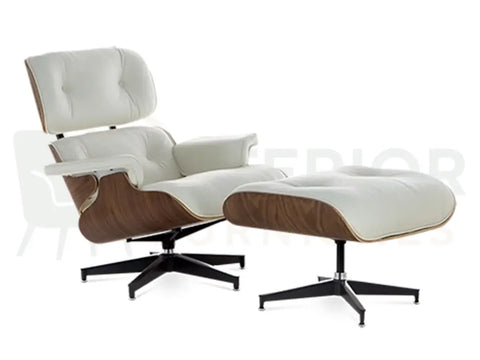 Bright white leather cushions contrast beautifully with a solid black aluminium base on this walnut wood Eames lounge chair replica, available from Interior Furnishes with delivery across the UK, Europe and USA from £799.
